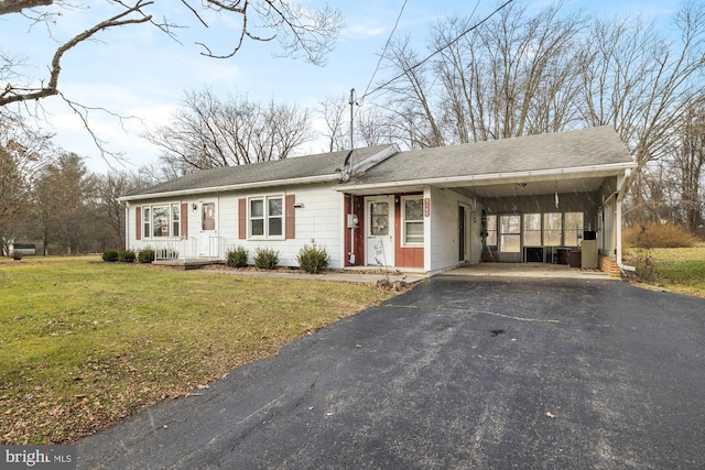 single story home with a carport and a front lawn