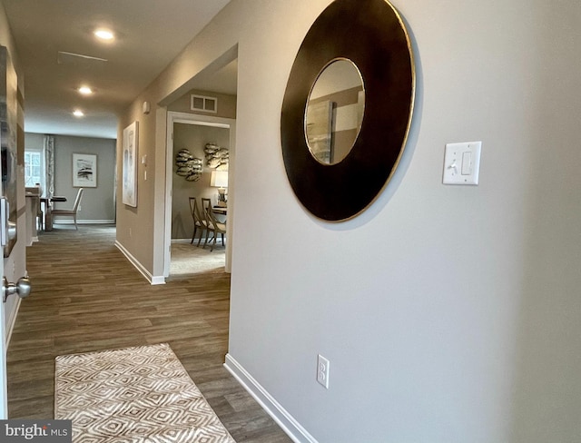 hall with dark wood-type flooring