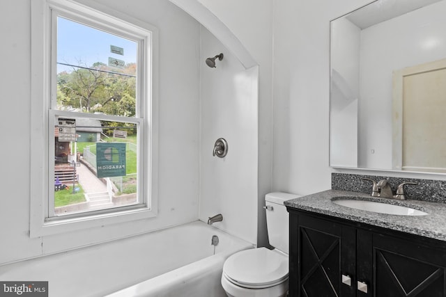 full bathroom featuring vanity, shower / bathing tub combination, a wealth of natural light, and toilet