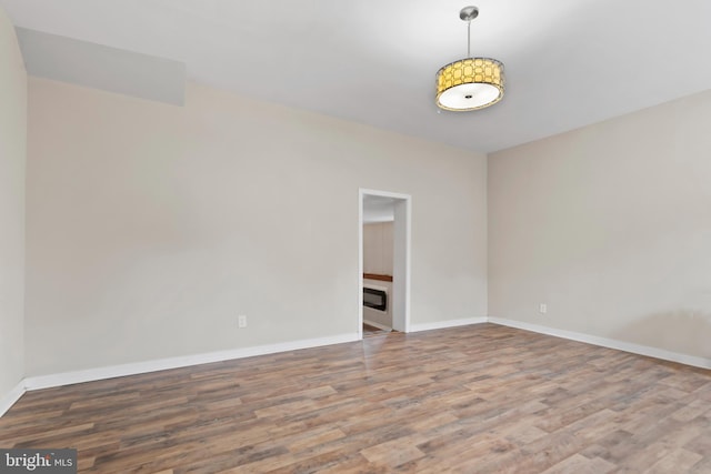 unfurnished room featuring wood-type flooring