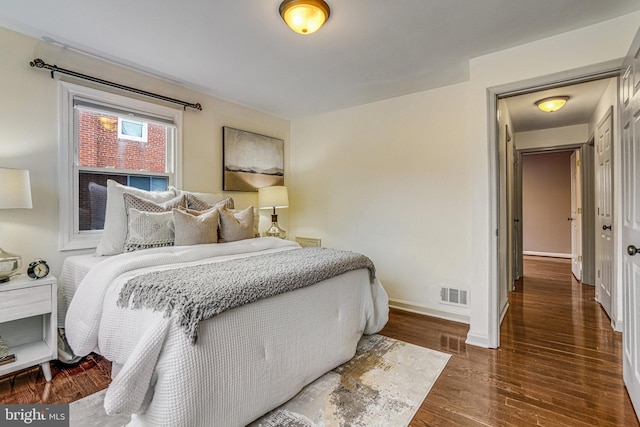 bedroom featuring dark hardwood / wood-style floors