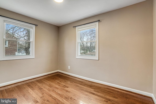 spare room with light wood-type flooring