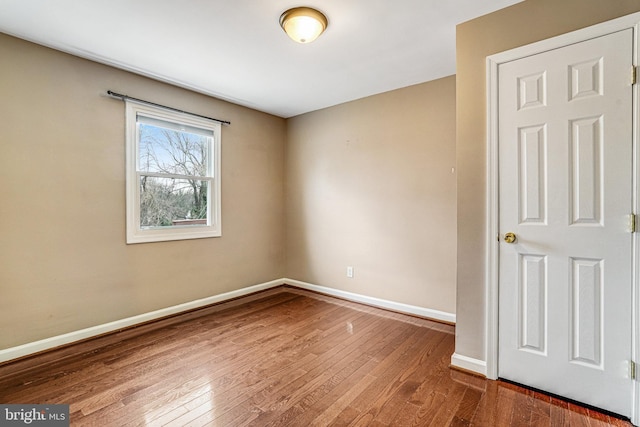 unfurnished room featuring hardwood / wood-style floors