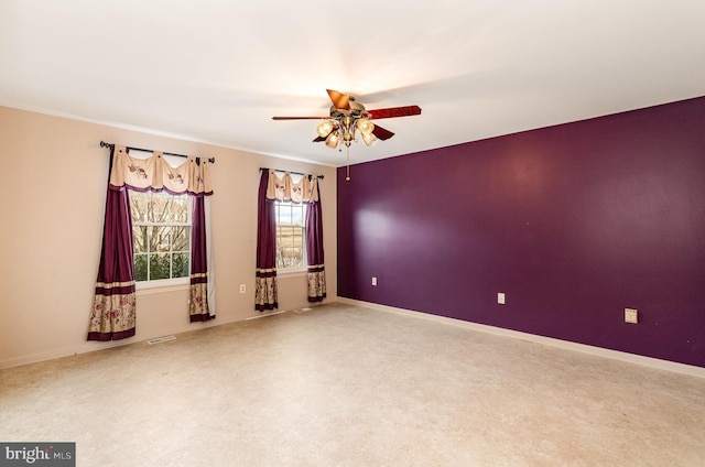 carpeted empty room with ceiling fan