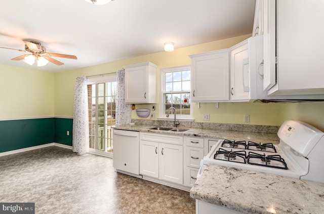 kitchen featuring white cabinetry, sink, white appliances, and ceiling fan