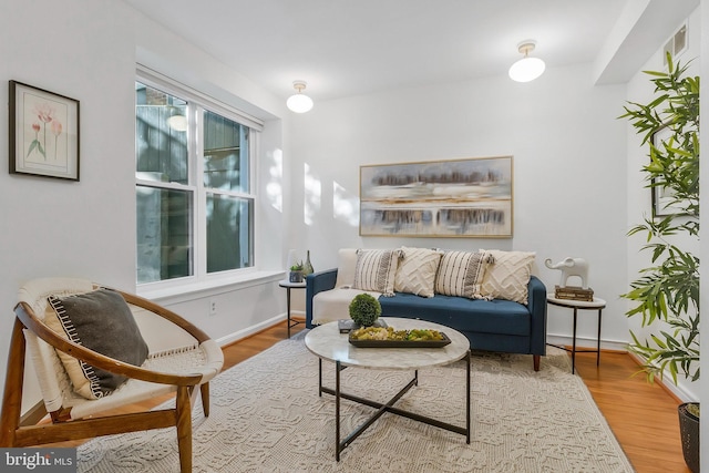 sitting room featuring light hardwood / wood-style flooring