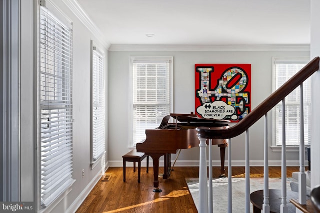 misc room with crown molding and dark hardwood / wood-style floors