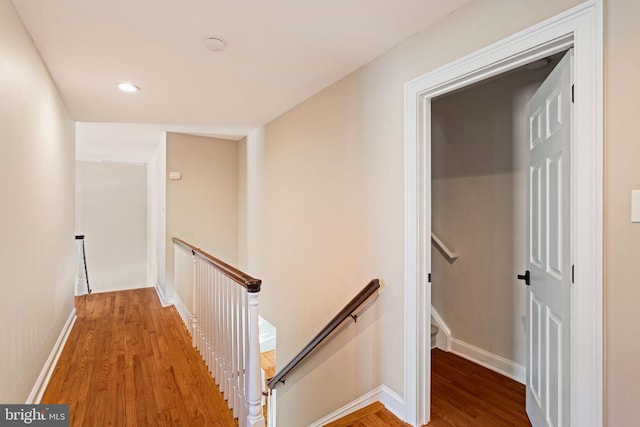 corridor with wood-type flooring