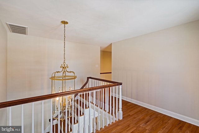 corridor featuring hardwood / wood-style floors