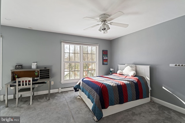 carpeted bedroom featuring a baseboard radiator and ceiling fan