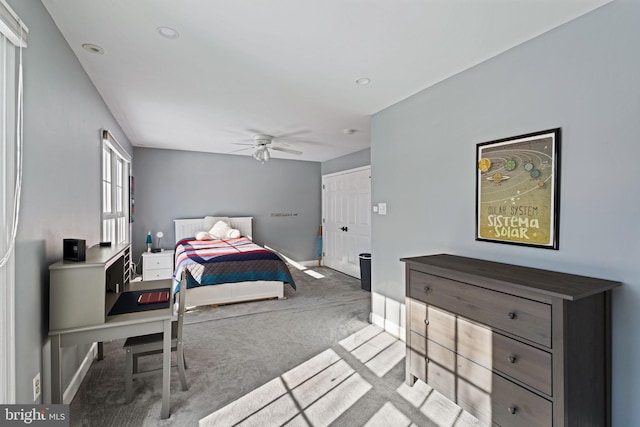 carpeted bedroom with ceiling fan