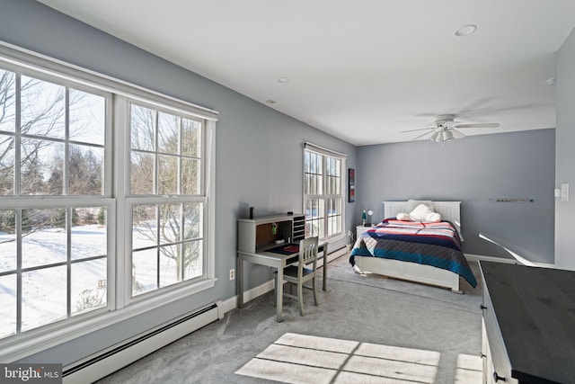 carpeted bedroom featuring a baseboard radiator