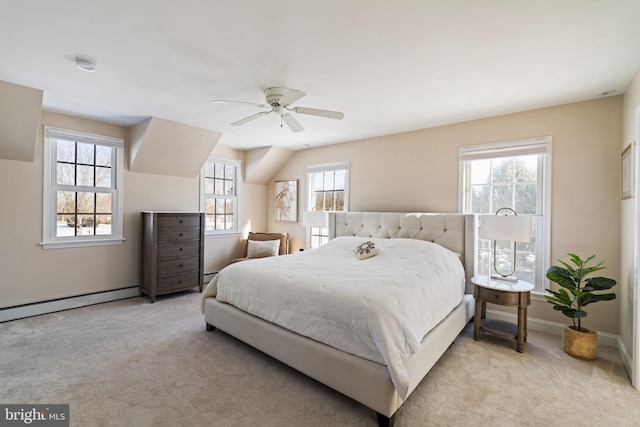 carpeted bedroom featuring ceiling fan and baseboard heating