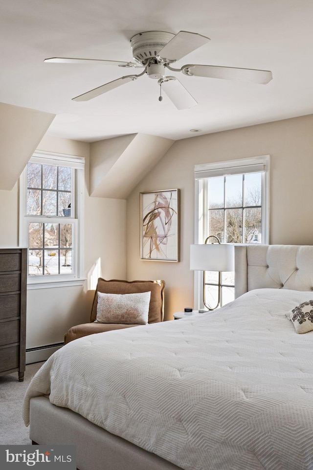 bedroom featuring a baseboard radiator, carpet, lofted ceiling, and ceiling fan