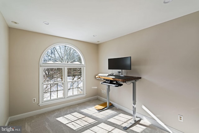 home office with light colored carpet