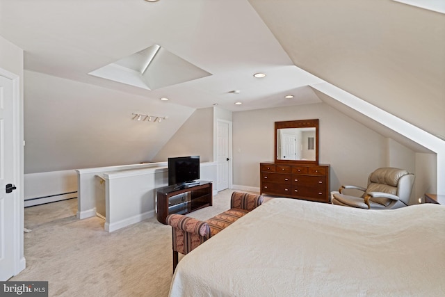 bedroom with a baseboard radiator, light colored carpet, and vaulted ceiling with skylight