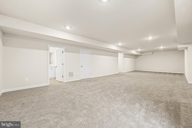 basement with light colored carpet