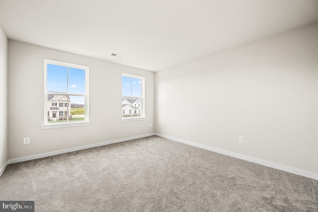 unfurnished room with carpet floors