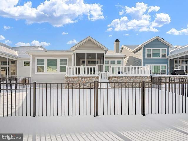 exterior space with a fenced front yard and a porch