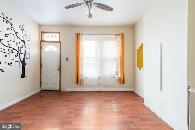 foyer with ceiling fan and hardwood / wood-style floors