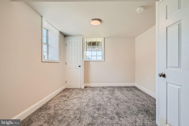 carpeted spare room with a healthy amount of sunlight