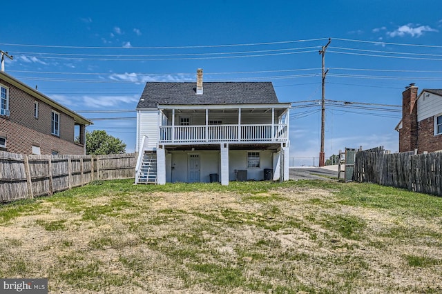 back of house with a yard, central AC unit, and a wooden deck