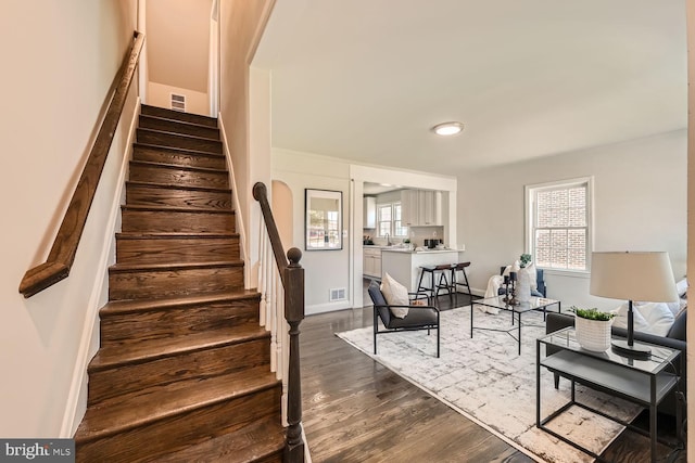 staircase featuring hardwood / wood-style floors