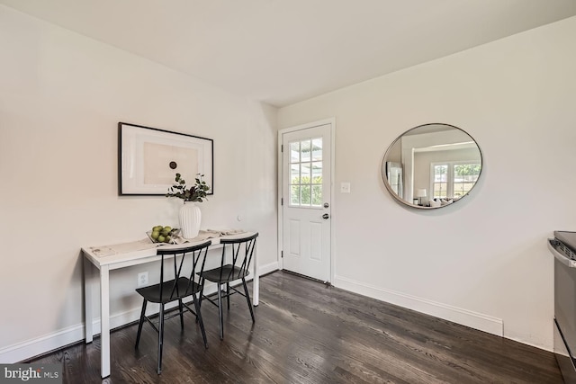 office space with dark wood-type flooring