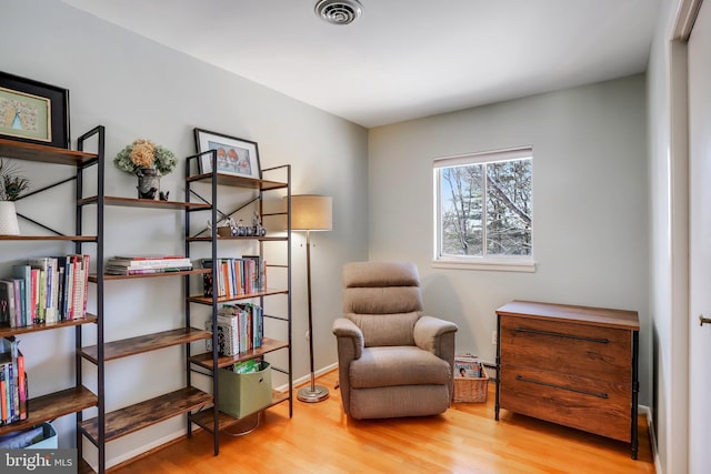 living area featuring hardwood / wood-style floors