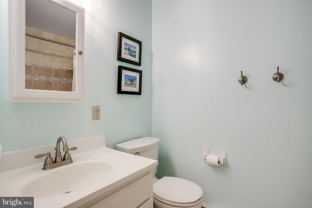 bathroom with toilet and vanity