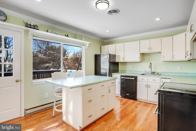 kitchen with a baseboard heating unit, dishwasher, stainless steel fridge, and white cabinetry