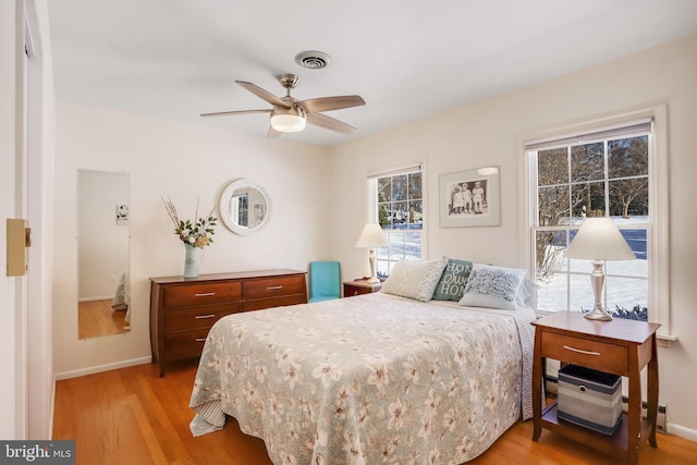 bedroom featuring ceiling fan and light wood-type flooring