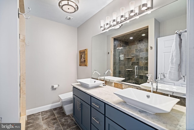 bathroom featuring vanity, an enclosed shower, tile patterned floors, and toilet