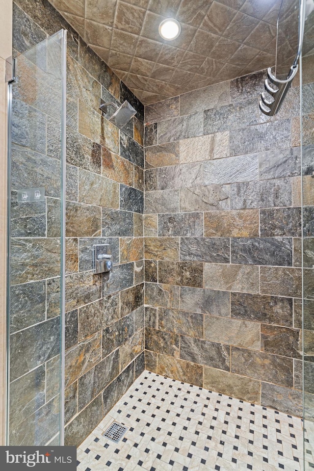 bathroom with tiled shower