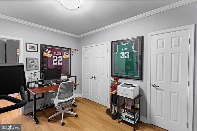 office with ornamental molding and light hardwood / wood-style floors