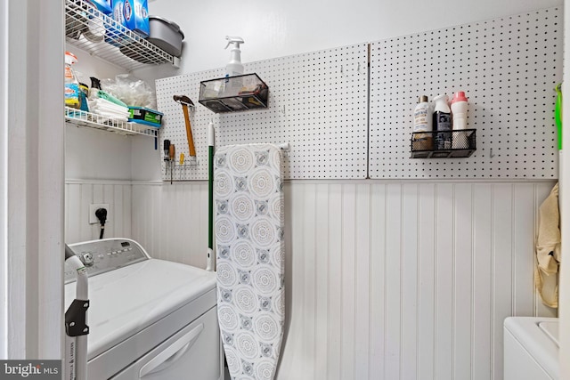 clothes washing area with independent washer and dryer