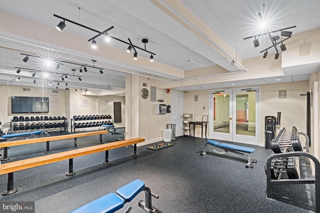 exercise room featuring french doors and track lighting