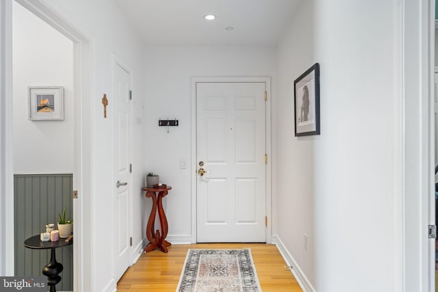 doorway with light wood-type flooring