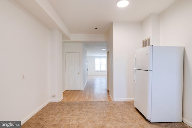 interior space with white fridge