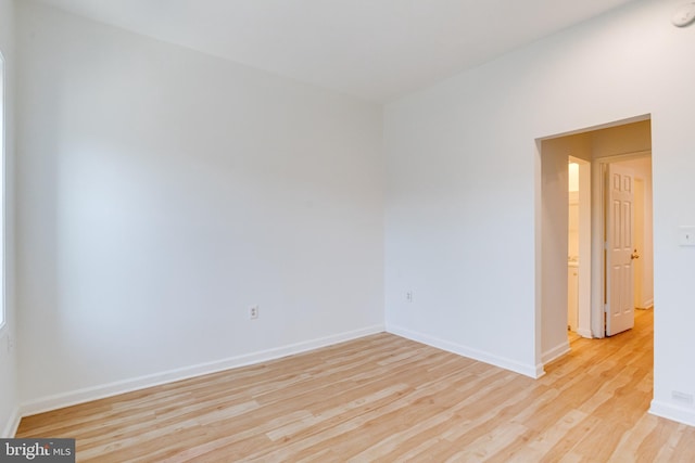 empty room with light hardwood / wood-style floors