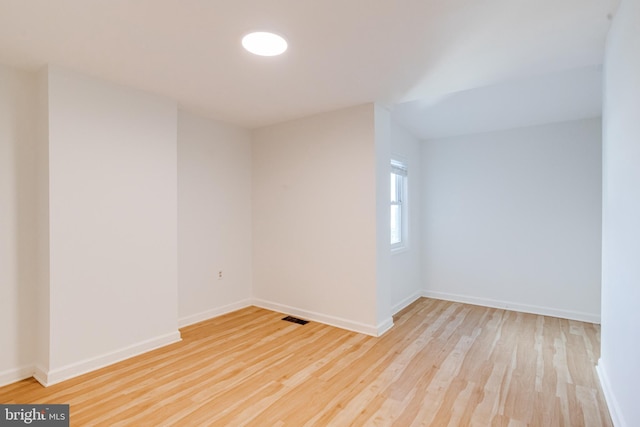 spare room featuring light hardwood / wood-style flooring