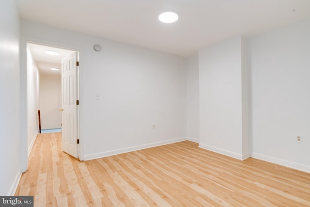 empty room with light hardwood / wood-style floors