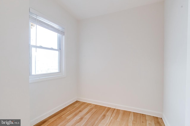 spare room with hardwood / wood-style flooring