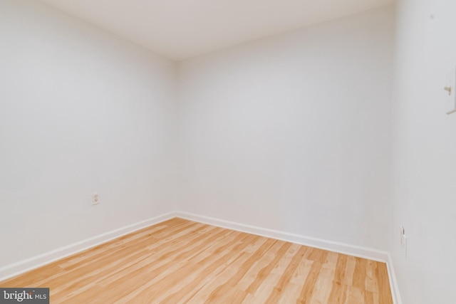 empty room with wood-type flooring