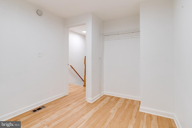 interior space featuring hardwood / wood-style floors and a closet