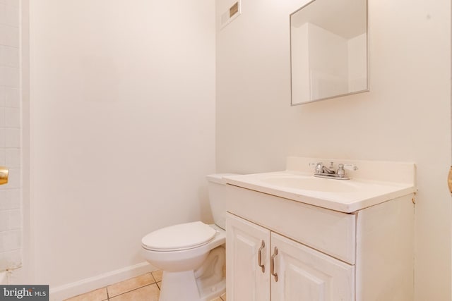 bathroom with vanity, toilet, and tile patterned flooring