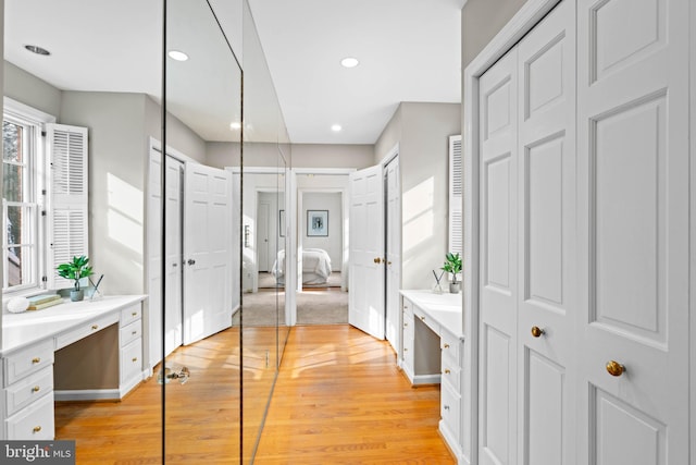 bathroom with hardwood / wood-style flooring