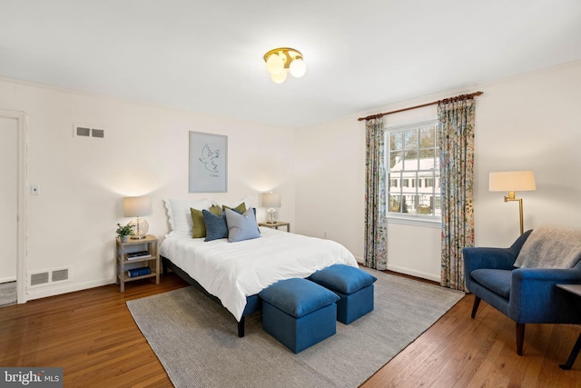 bedroom with hardwood / wood-style floors