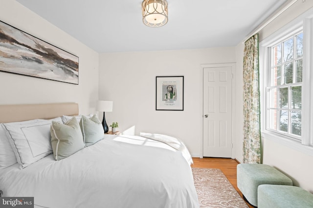 bedroom with light hardwood / wood-style floors