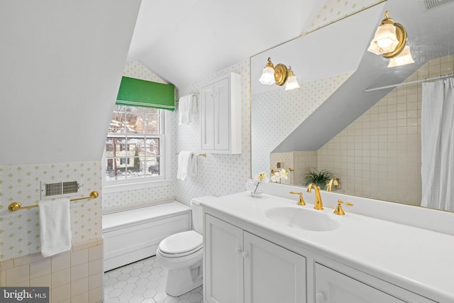 bathroom featuring toilet, tile patterned flooring, lofted ceiling, a shower with shower curtain, and vanity